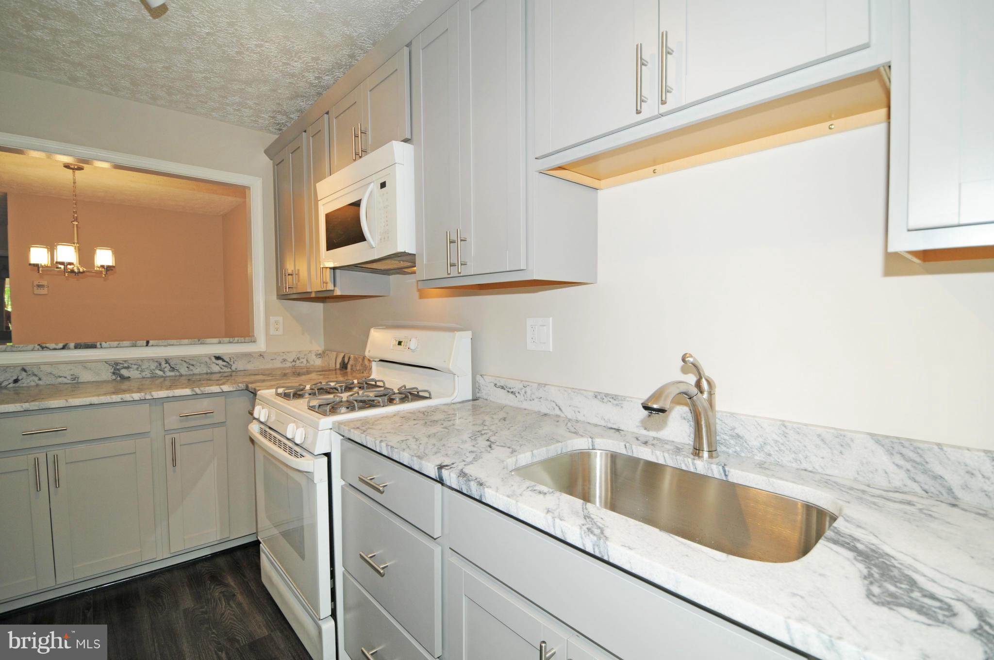10125 Oakton Terrace Road, Unit 10125 Oakton, VA 22124 - Photo 7 of 30 NEW BRUSHED NICKEL FAUCET AND DEEP UNDERMOUNT SINK
