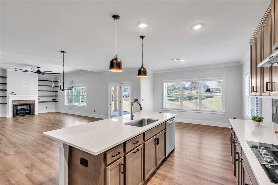 226 Holly Br Road Piedmont, SC 29673 - Photo 8 of 44 An open concept living area blends the kitchen, dining, and living room into a harmonious, connected space.