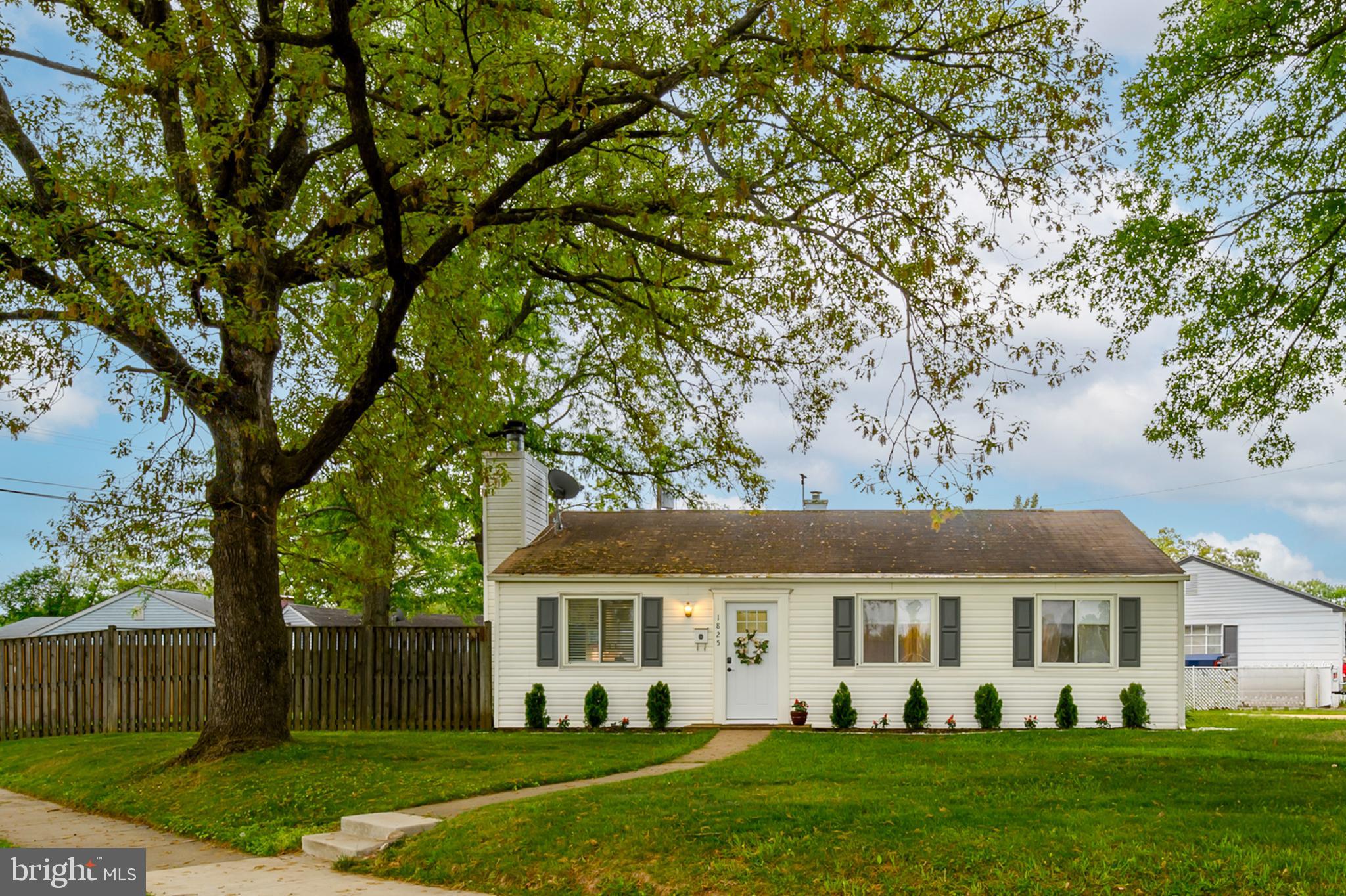 Charming home under a leafy canopy.