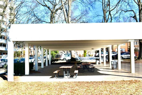 a view of a swimming pool with an outdoor seating