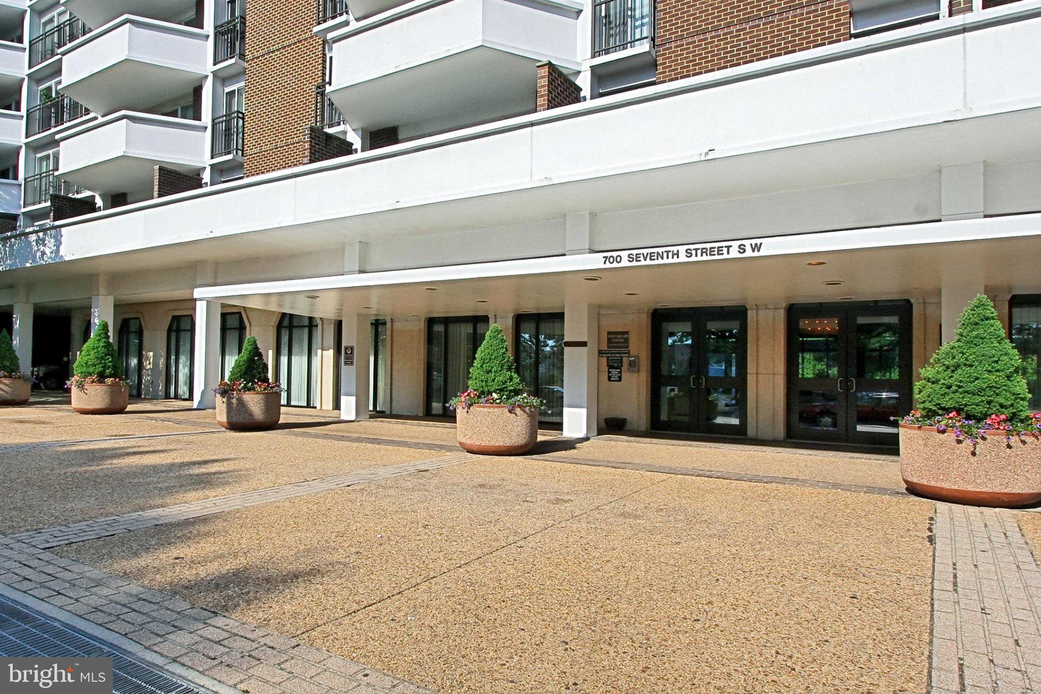 700 7th Street Southwest, Unit 730 Washington, DC 20024 - Photo 26 of 56 Modern entrance with lush greenery.