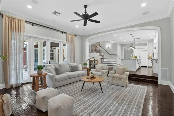 a kitchen with stainless steel appliances granite countertop a sink a stove a refrigerator and cabinets