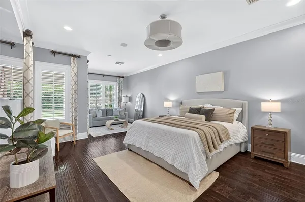 a kitchen with stainless steel appliances a refrigerator and wooden floor