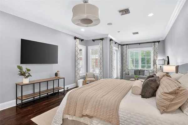a living room with furniture a bed and a window
