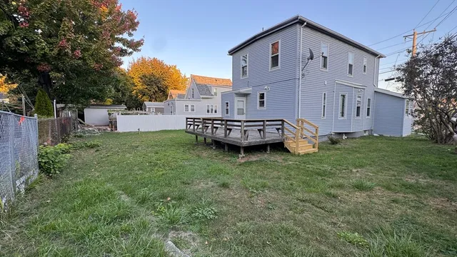 a view of a house with a back yard
