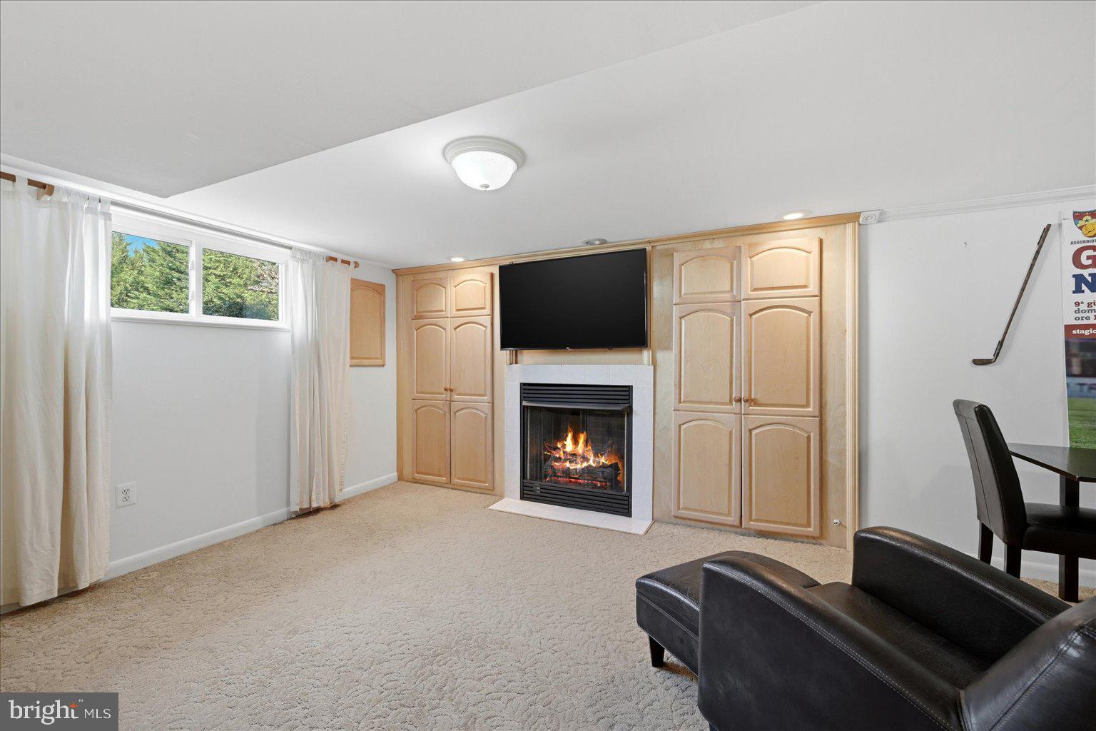 6020 Amherst Avenue Springfield, VA 22150 - Photo 31 of 56 Lower level gas fireplace