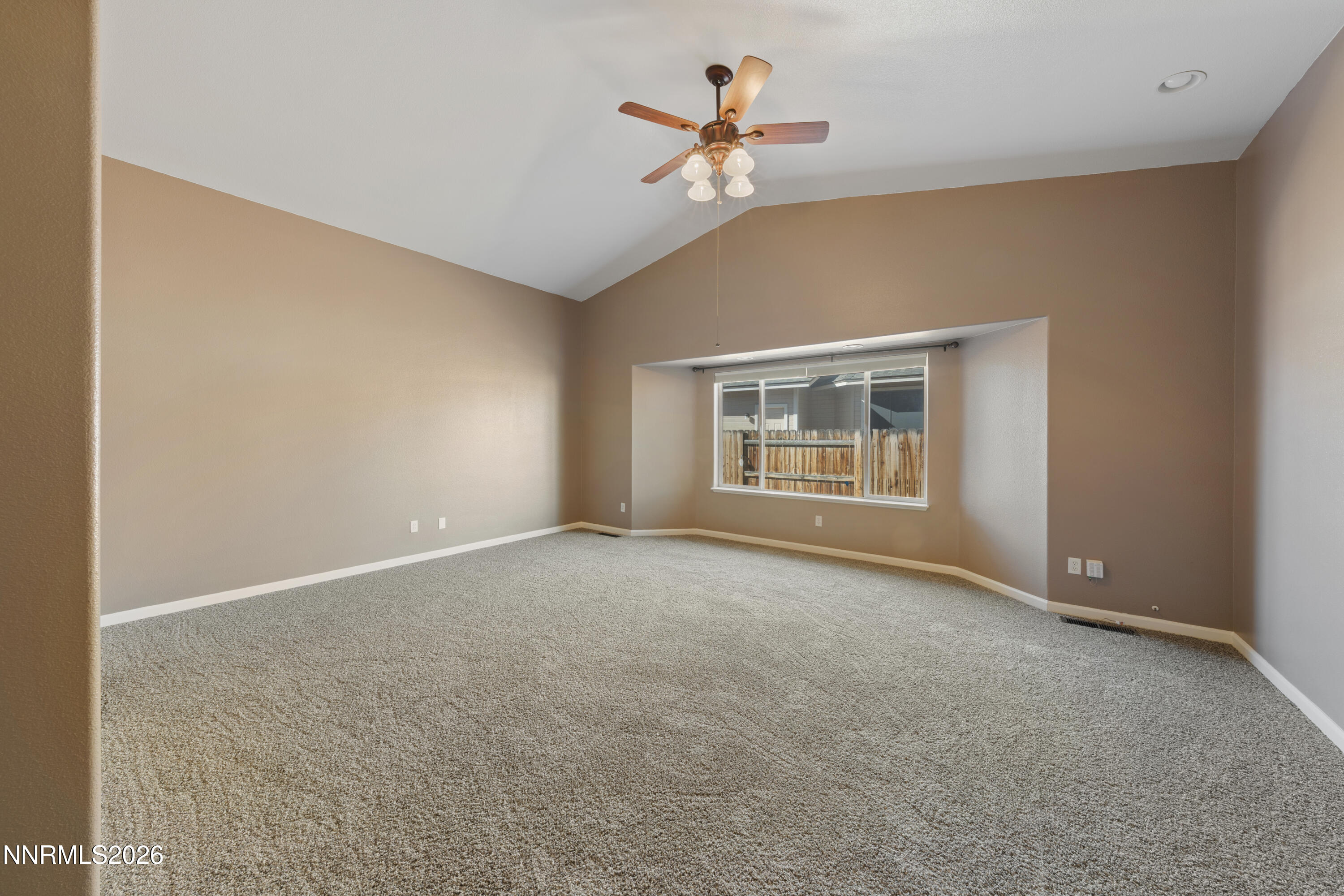 794 Mallard Way Fernley, NV 89408 - Photo 11 of 36 a view of an empty room with a window