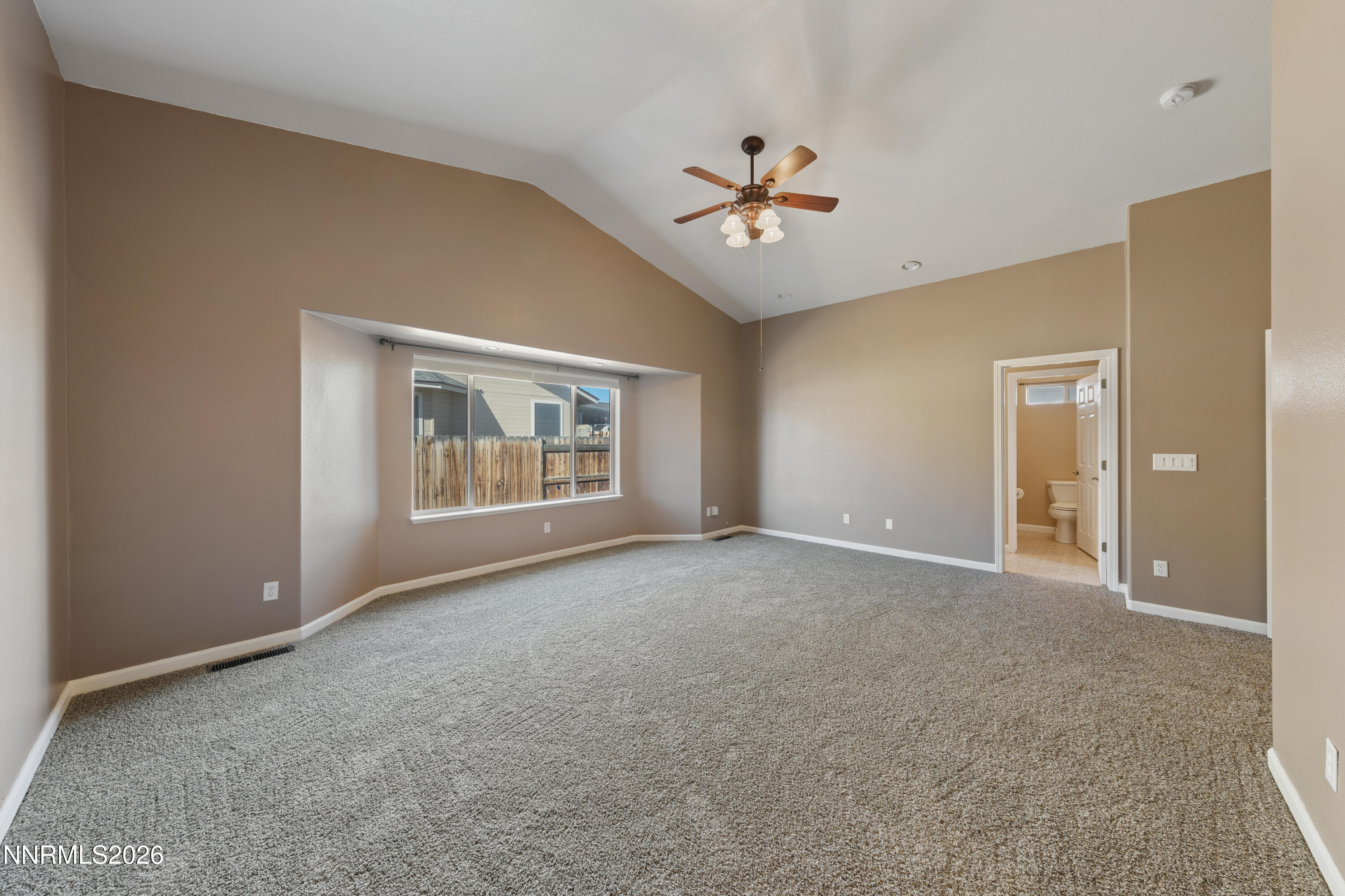794 Mallard Way Fernley, NV 89408 - Photo 13 of 36 a view of an empty room with a window