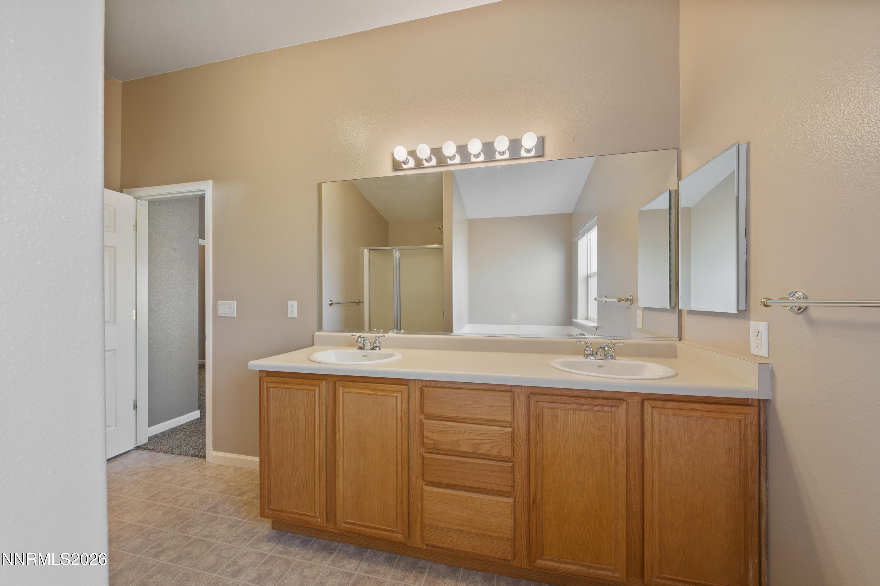 794 Mallard Way Fernley, NV 89408 - Photo 19 of 36 a bathroom with a double vanity sink and a mirror