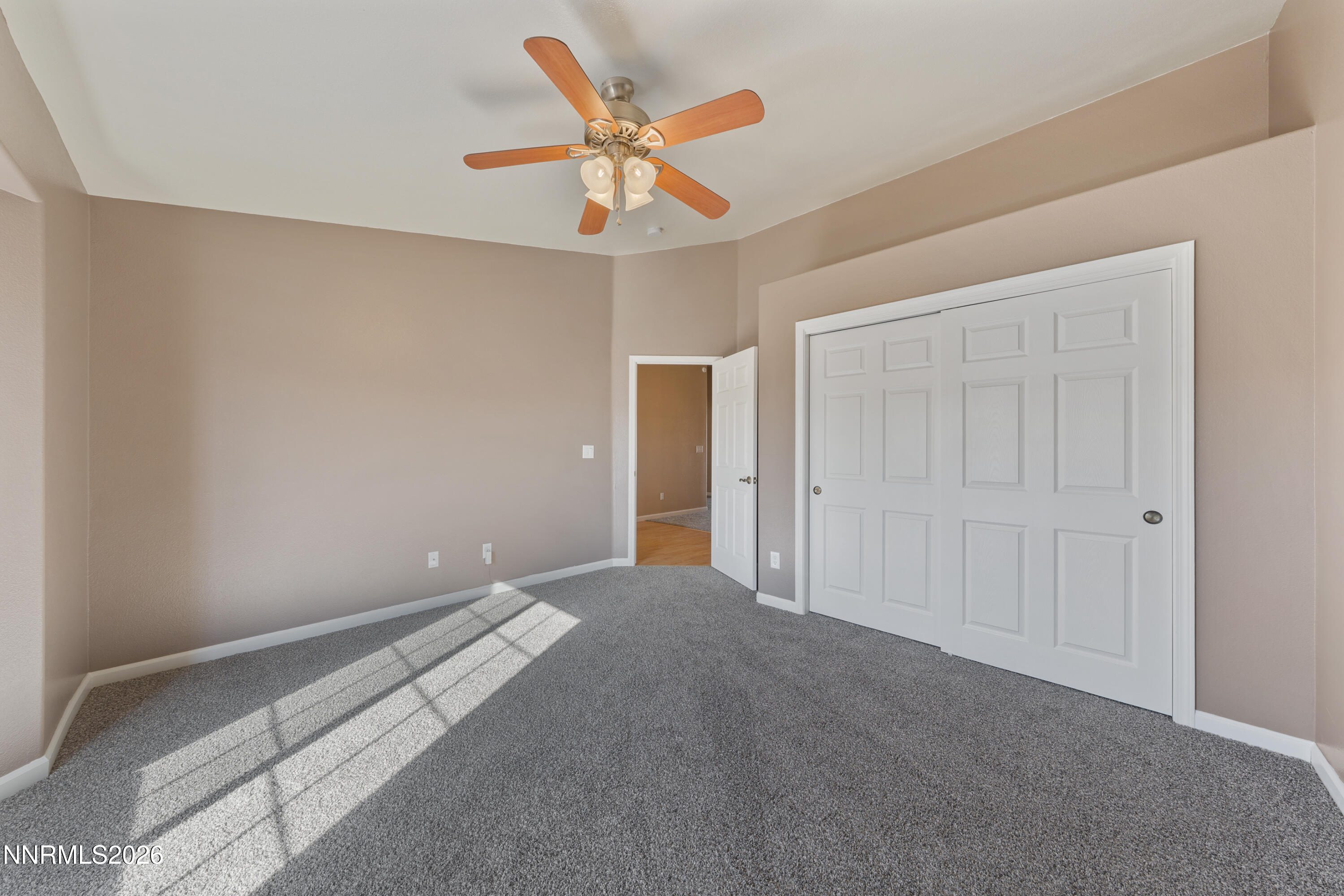 794 Mallard Way Fernley, NV 89408 - Photo 22 of 36 a view of a livingroom with a ceiling fan