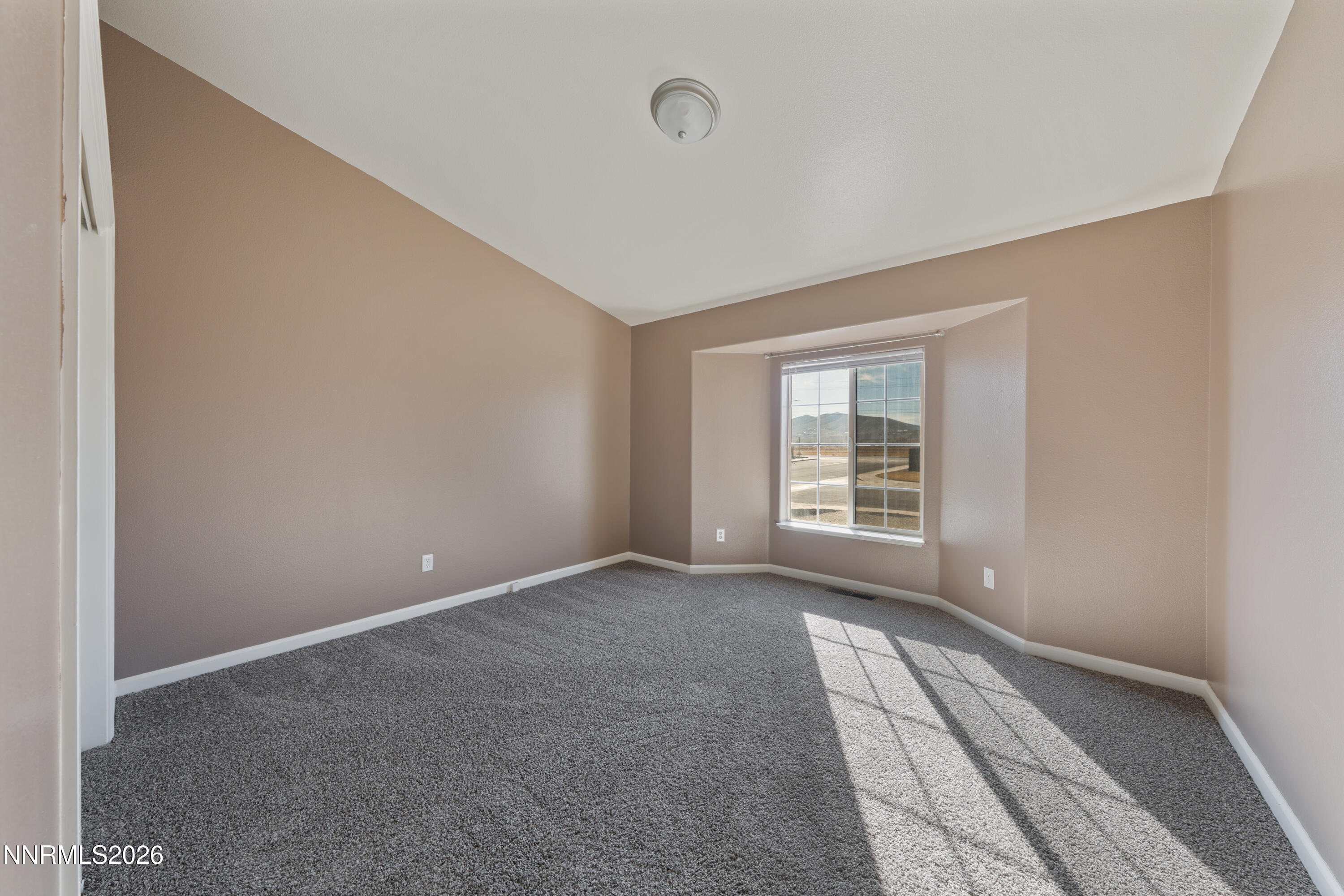 794 Mallard Way Fernley, NV 89408 - Photo 23 of 36 a view of an empty room with a window