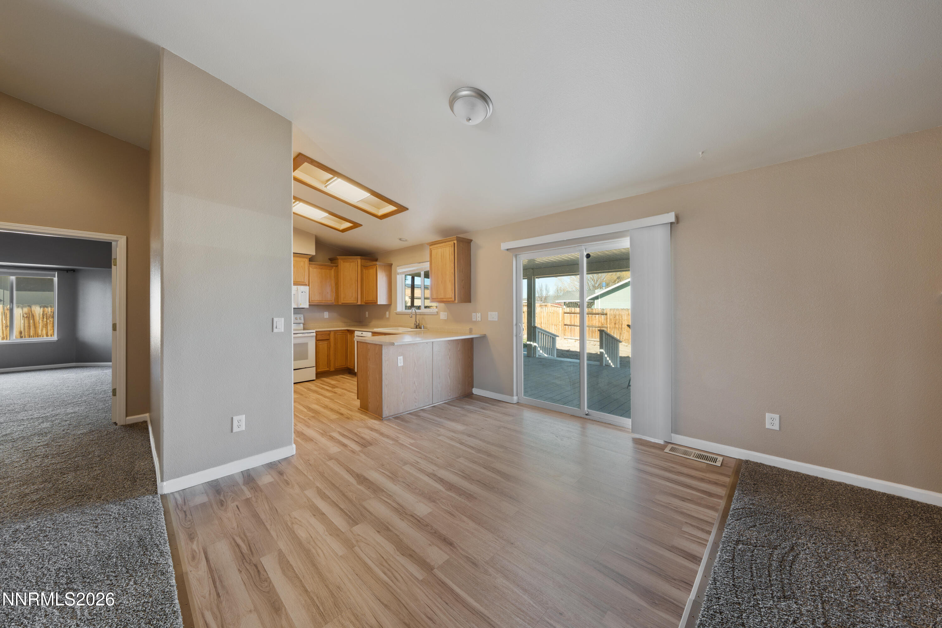 794 Mallard Way Fernley, NV 89408 - Photo 3 of 36 a view of a kitchen with wooden floor and a kitchen