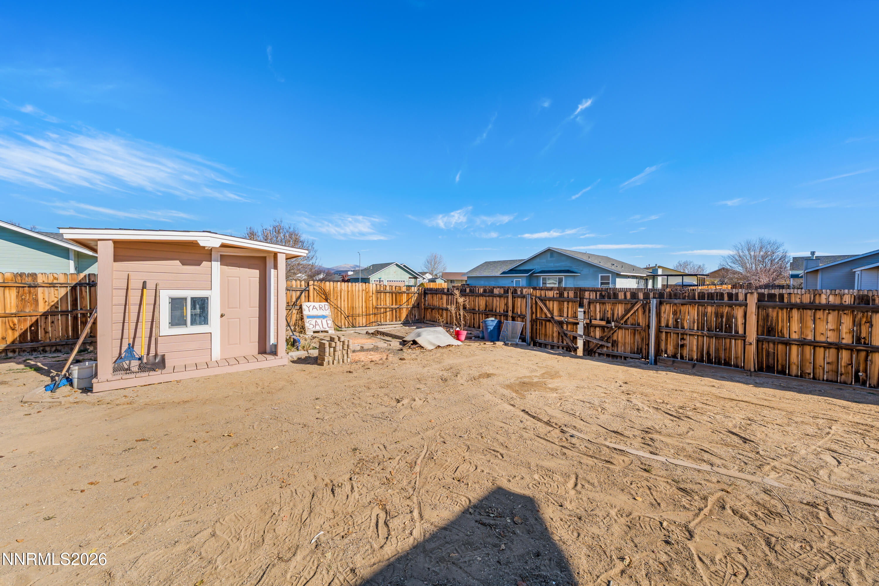 794 Mallard Way Fernley, NV 89408 - Photo 32 of 36 a view of a house with wooden fence
