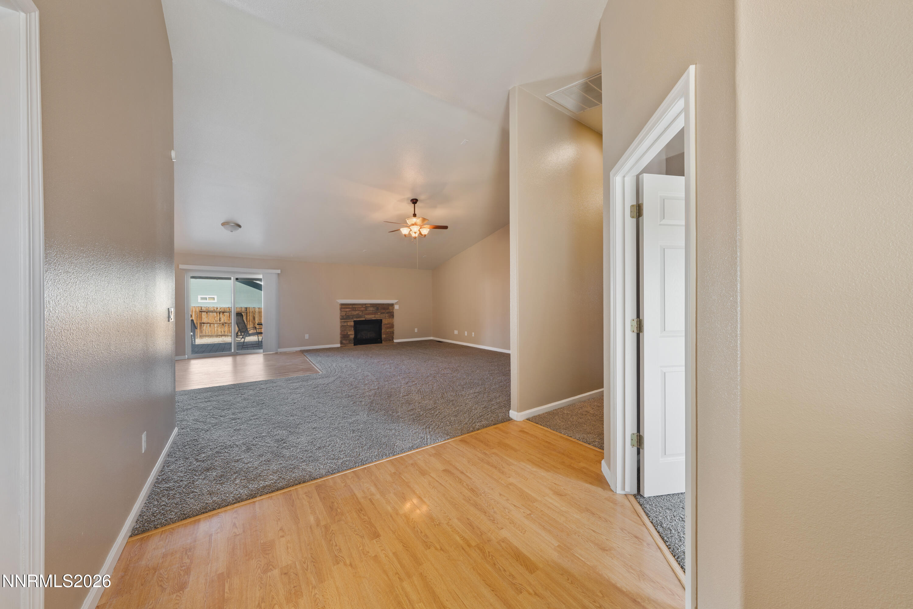 794 Mallard Way Fernley, NV 89408 - Photo 10 of 36 a view of a hallway to a bedroom and a bedroom