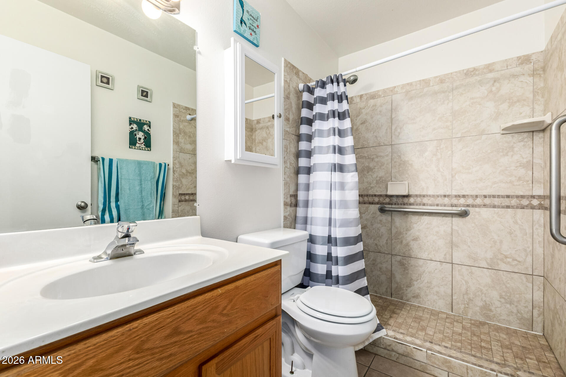 600 South Dobson Road, Unit 122 Mesa, AZ 85202 - Photo 8 of 28 a bathroom with a sink toilet and shower