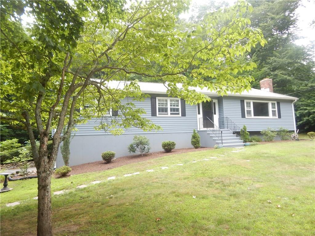 133 Woodsvale Road Madison, CT 06443 - Photo 1 of 1 a view of a house with a yard and a tree