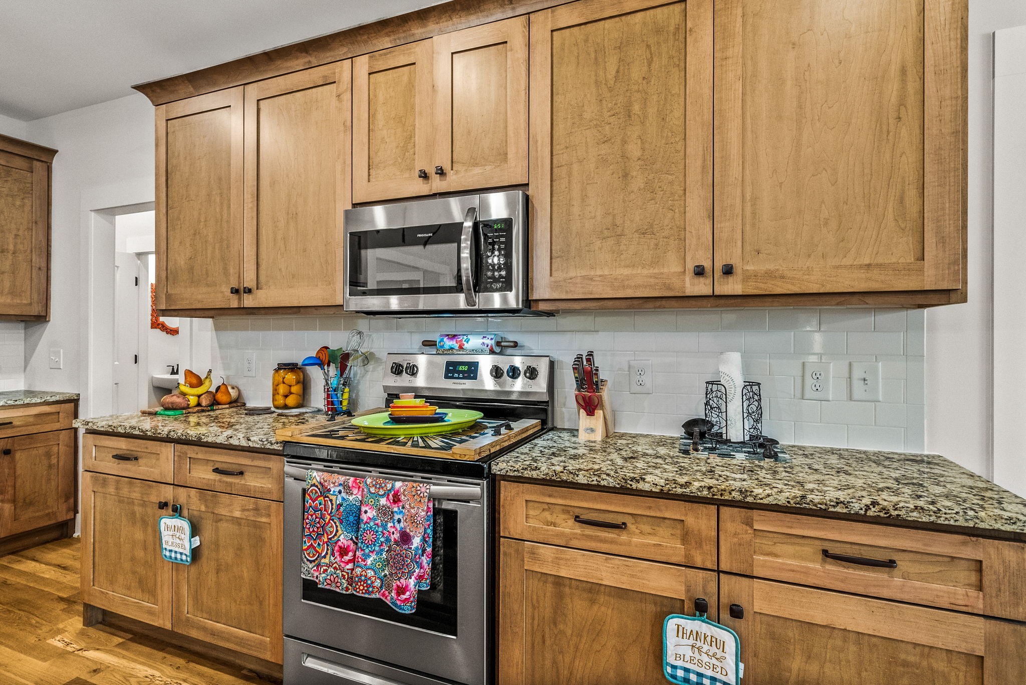 3378 New Hall Road Greenbrier, TN 37073 - Photo 33 of 83 a kitchen with stainless steel appliances granite countertop a sink a stove and cabinets