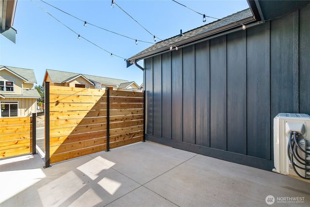 a view of a door and wooden walls