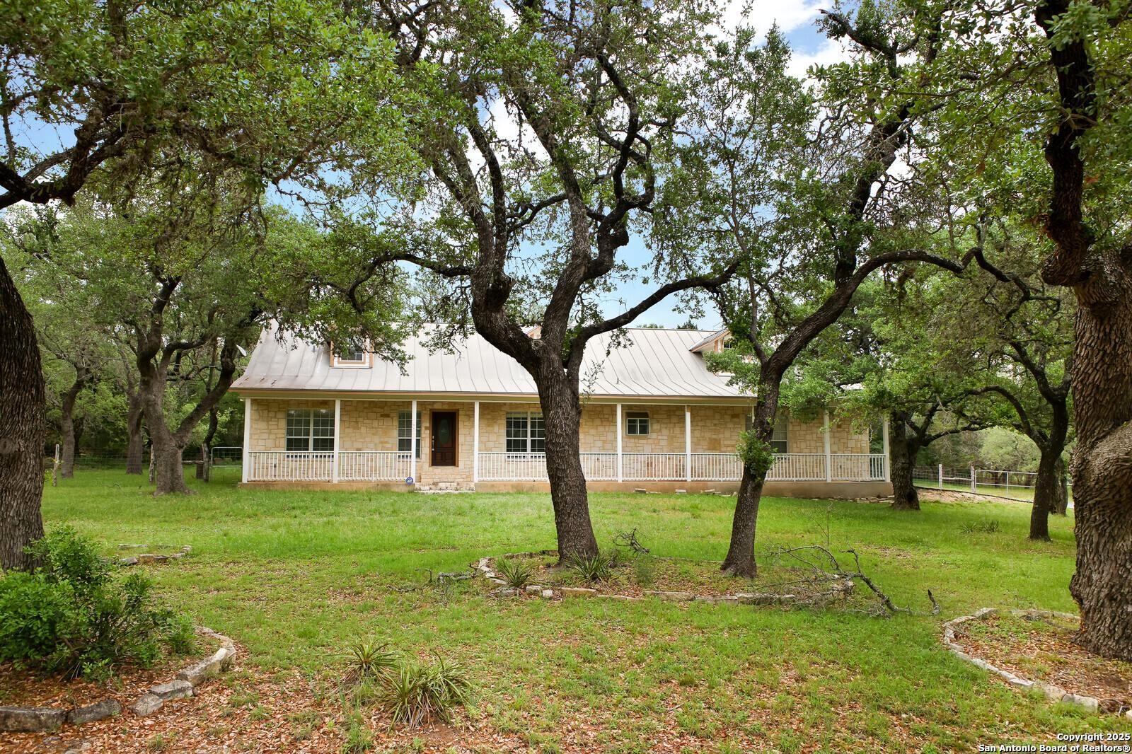 341 Indigo Run Drive Bulverde, TX 78163 - Photo 1 of 37 a front view of house with a garden