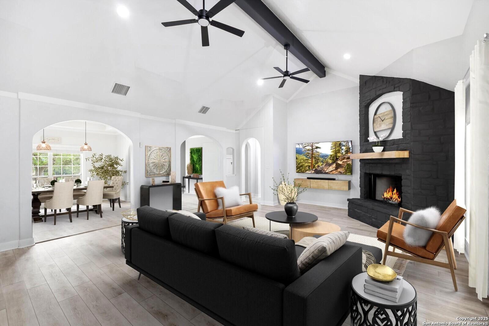 341 Indigo Run Drive Bulverde, TX 78163 - Photo 13 of 37 a living room with furniture and a fireplace