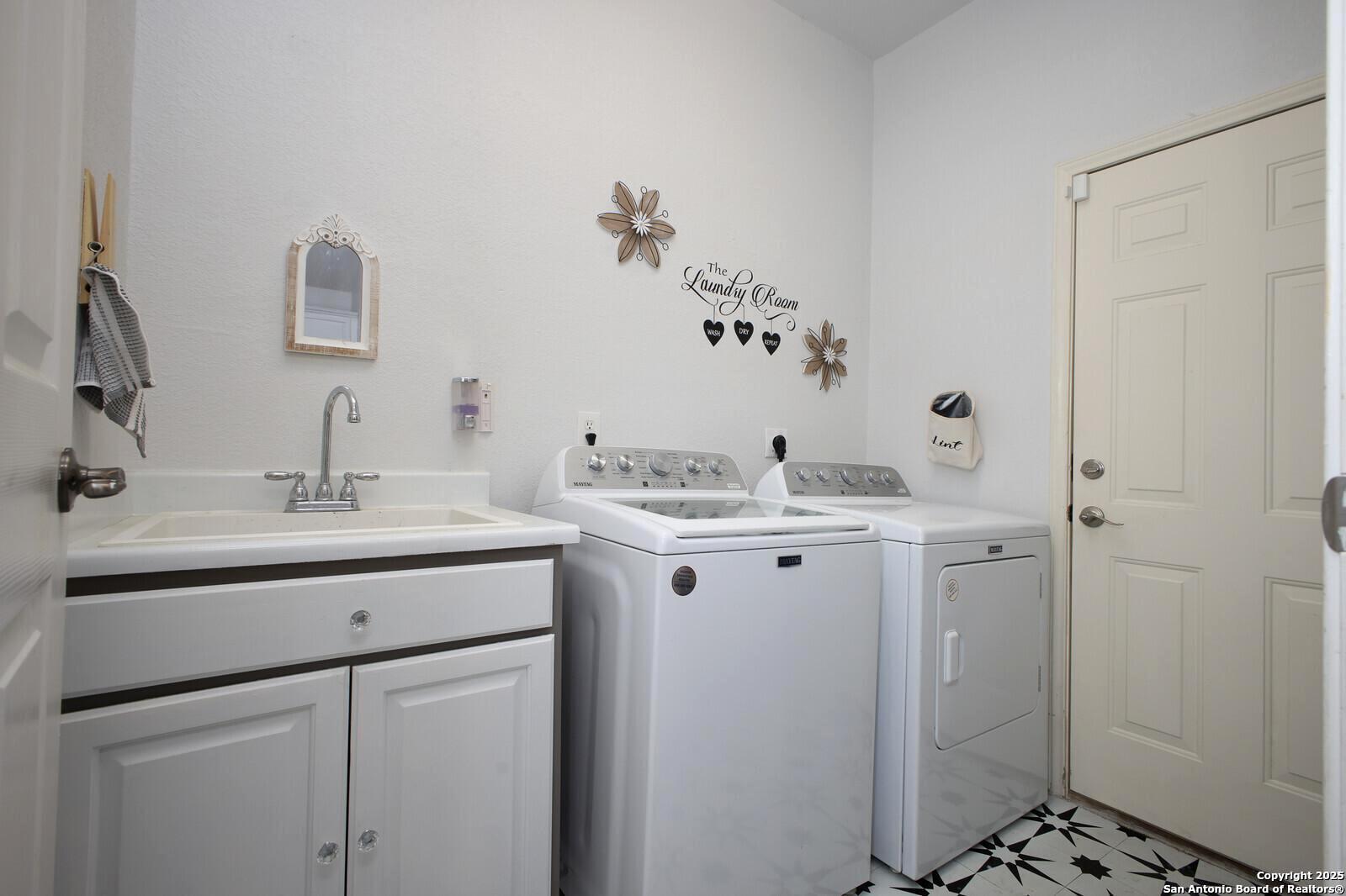 341 Indigo Run Drive Bulverde, TX 78163 - Photo 20 of 37 a bathroom with a granite countertop sink a toilet and a mirror