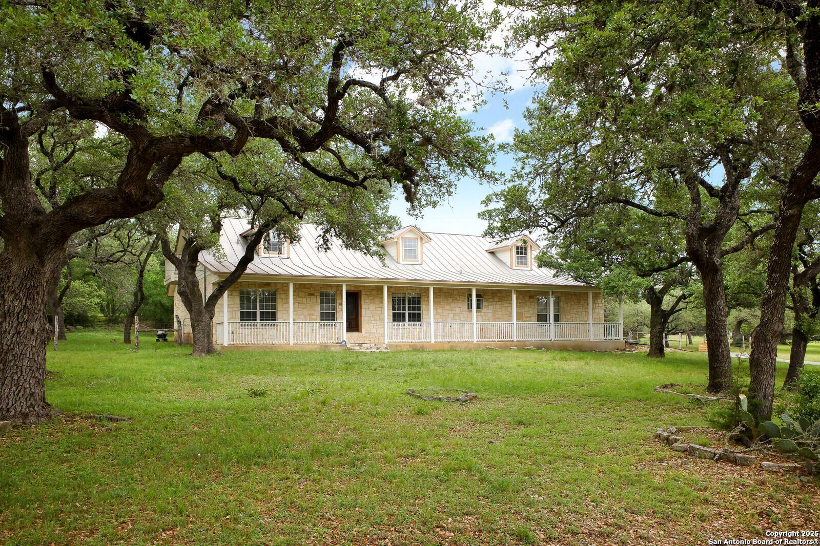 341 Indigo Run Drive Bulverde, TX 78163 - Photo 2 of 37 a front view of a house with a garden