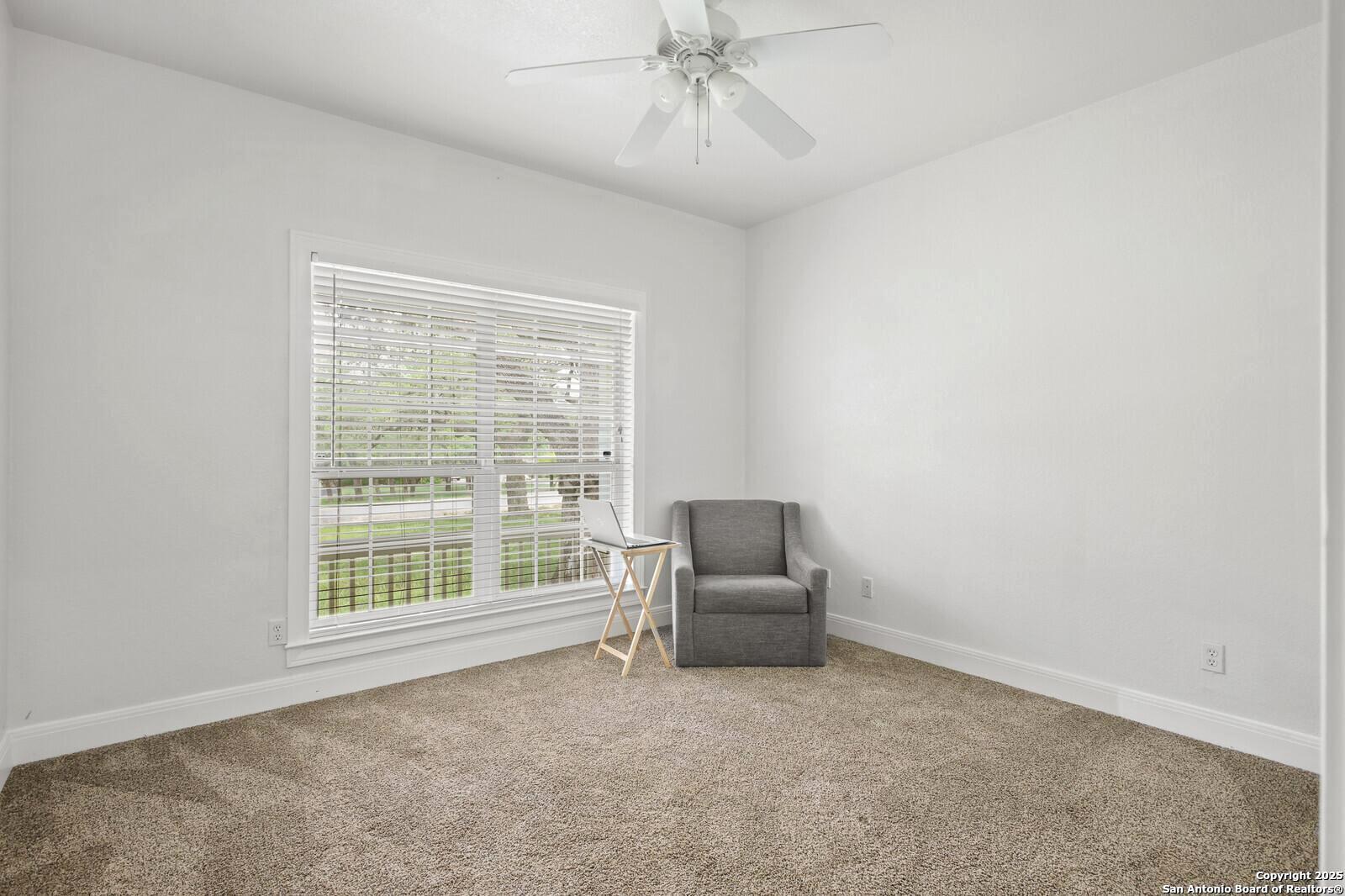 341 Indigo Run Drive Bulverde, TX 78163 - Photo 26 of 37 a living room with furniture and a window