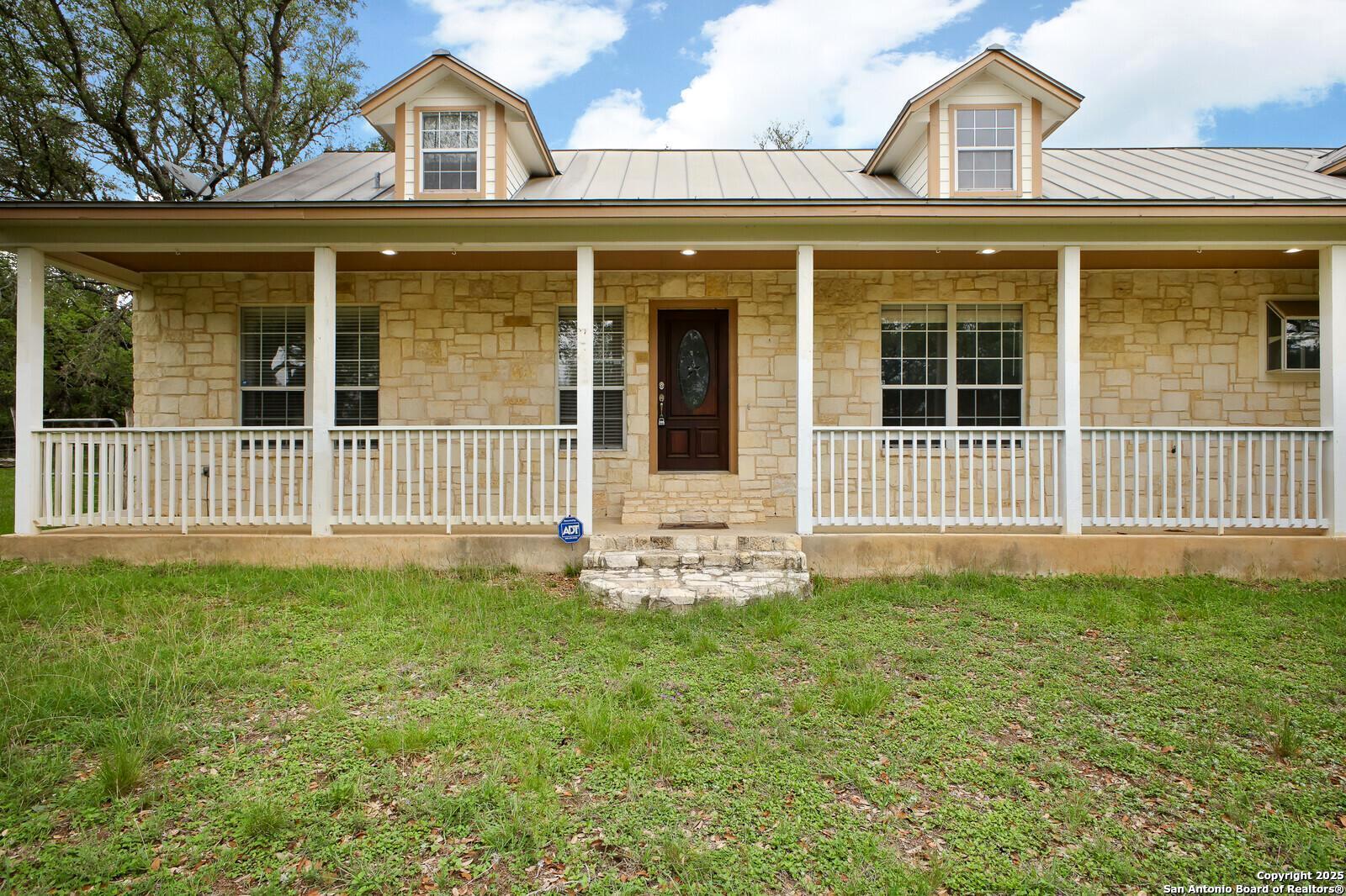 341 Indigo Run Drive Bulverde, TX 78163 - Photo 3 of 37 front view of a house with a yard