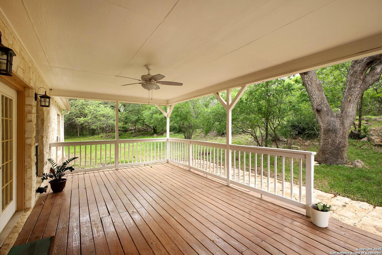 341 Indigo Run Drive Bulverde, TX 78163 - Photo 31 of 37 a view of a balcony with wooden floor
