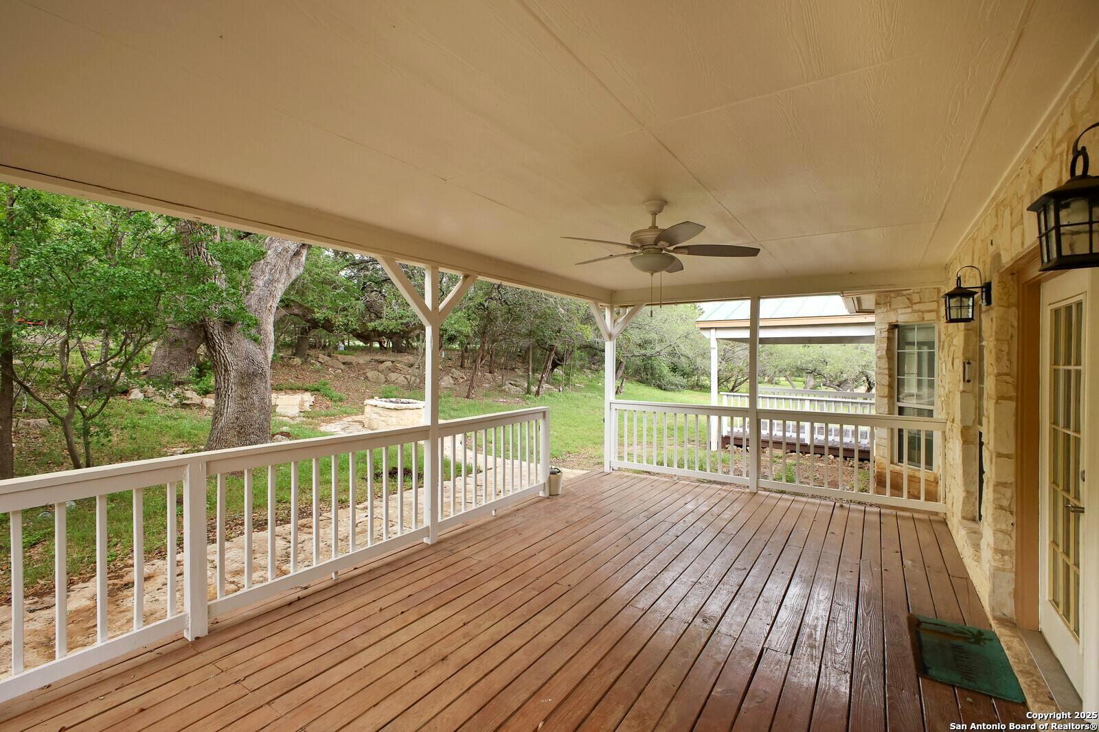 341 Indigo Run Drive Bulverde, TX 78163 - Photo 32 of 37 a view of a balcony with wooden floor
