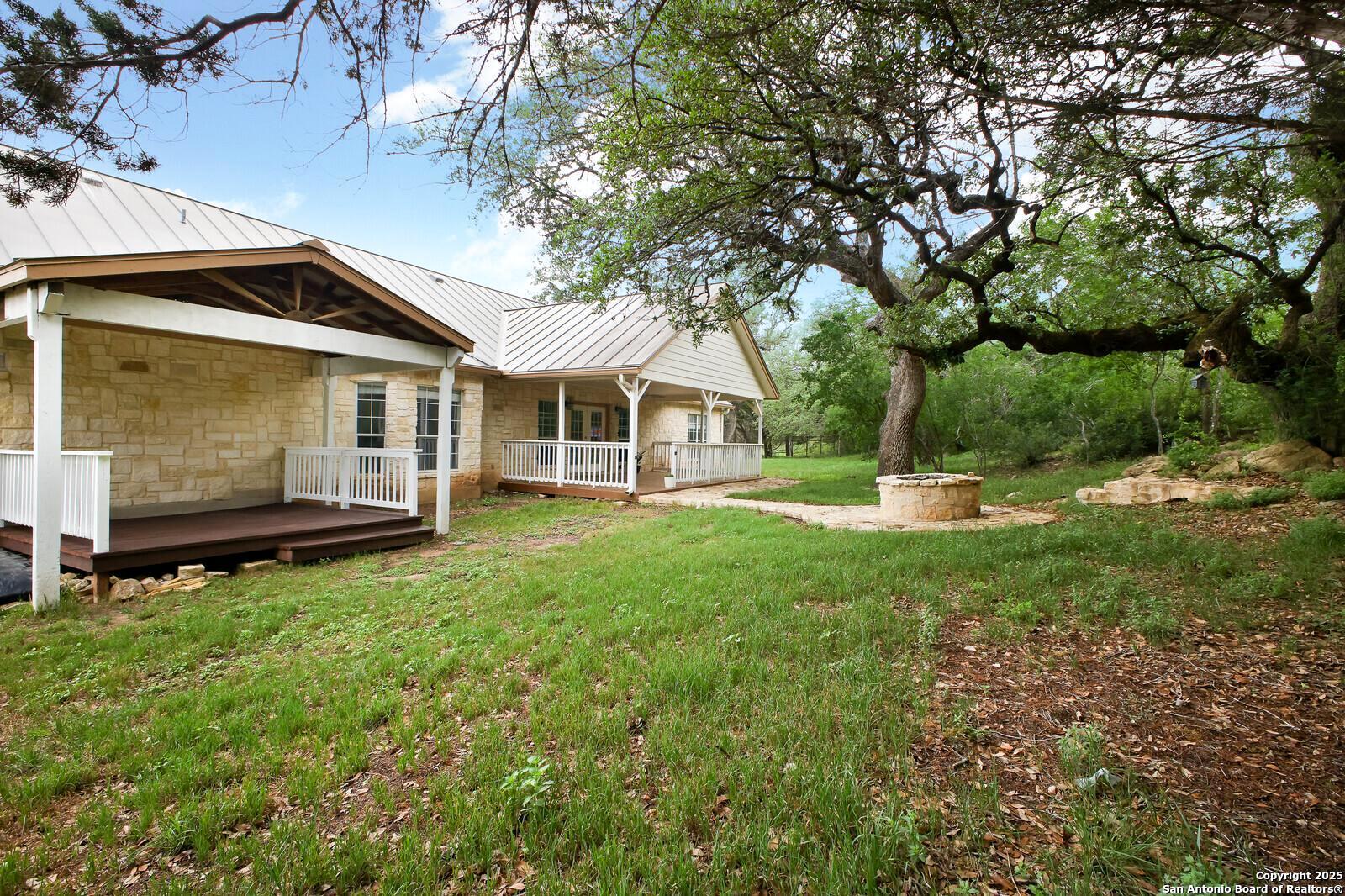 341 Indigo Run Drive Bulverde, TX 78163 - Photo 35 of 37 a front view of a house with a garden