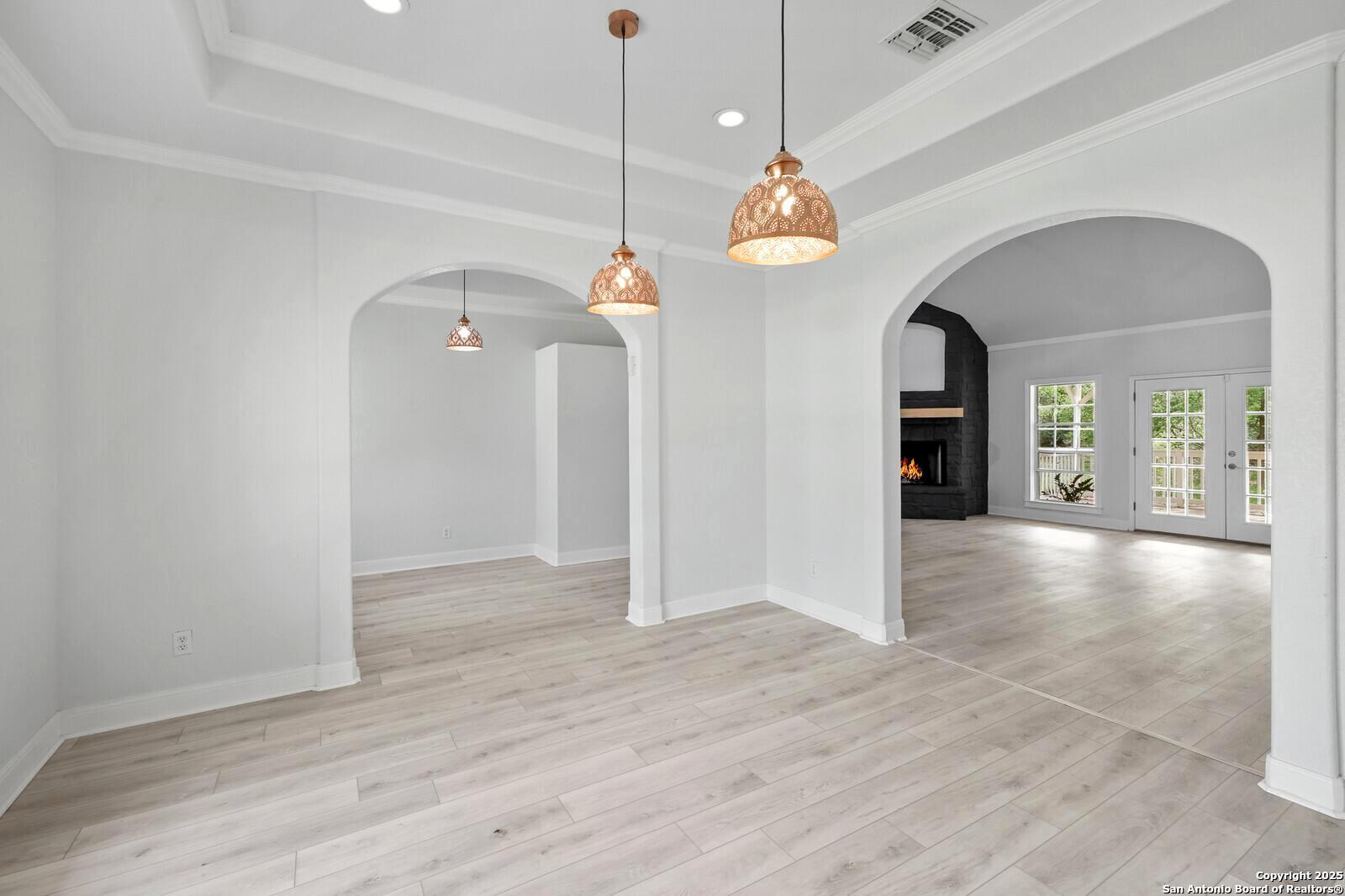 341 Indigo Run Drive Bulverde, TX 78163 - Photo 9 of 37 wooden floor in an empty room with a window