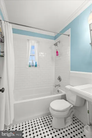 a bathroom with a toilet a sink and a bathtub