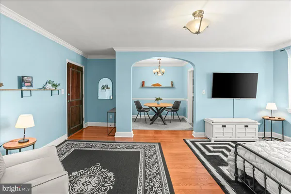 a living room with furniture and a flat screen tv