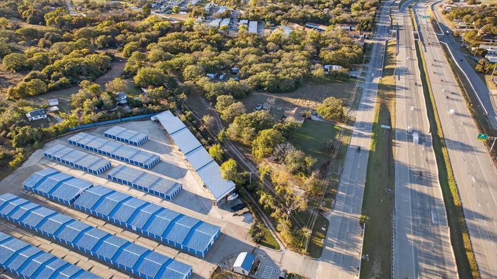 936 Southeast Parkway Azle, TX 76020 - Photo 3 of 14 View of property location featuring a tree filled landscape