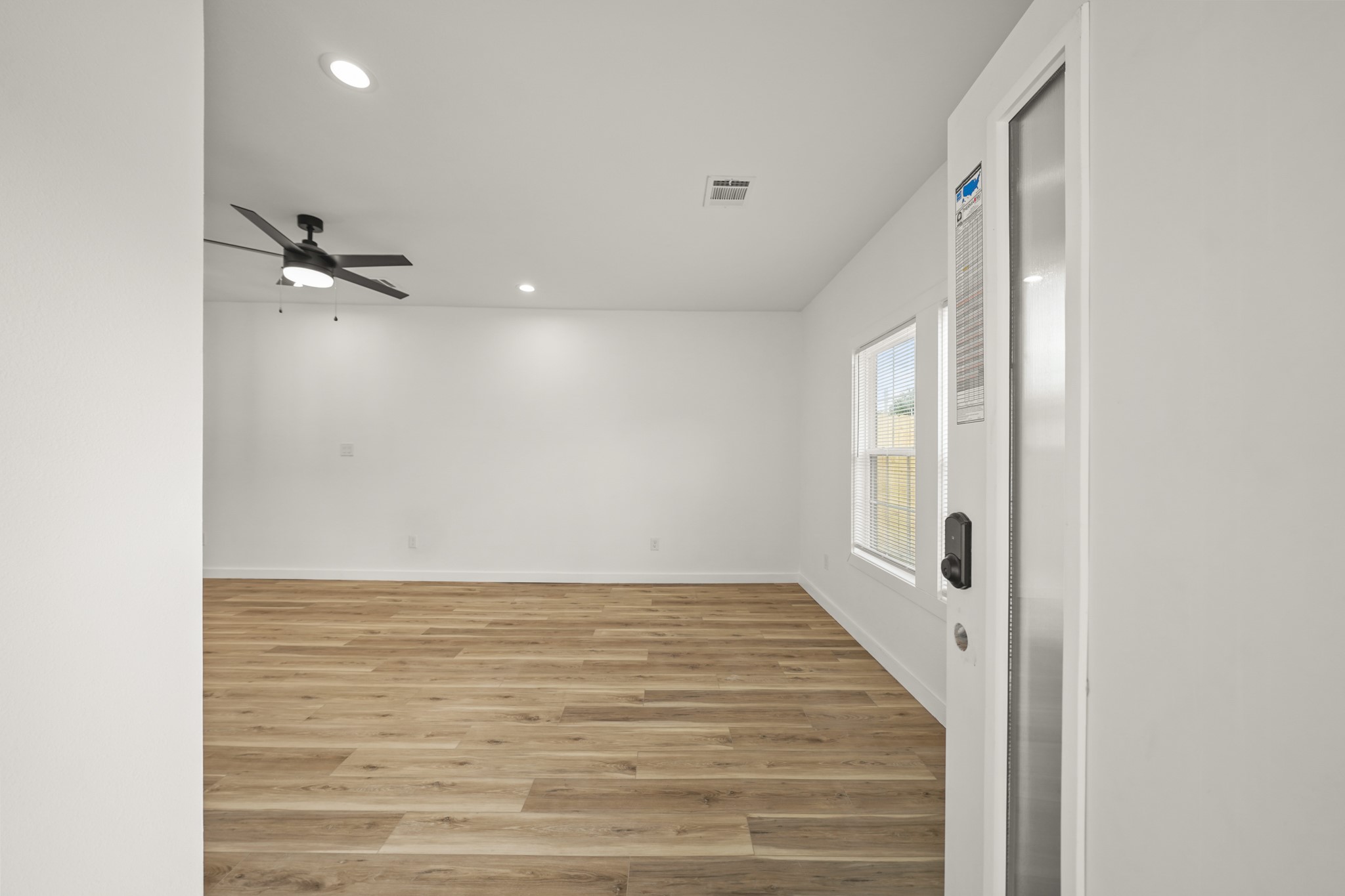 6206 Lyndhurst Drive, Unit AB Houston, TX 77087 - Photo 4 of 14 a view of a room with a staircase and a ceiling fan