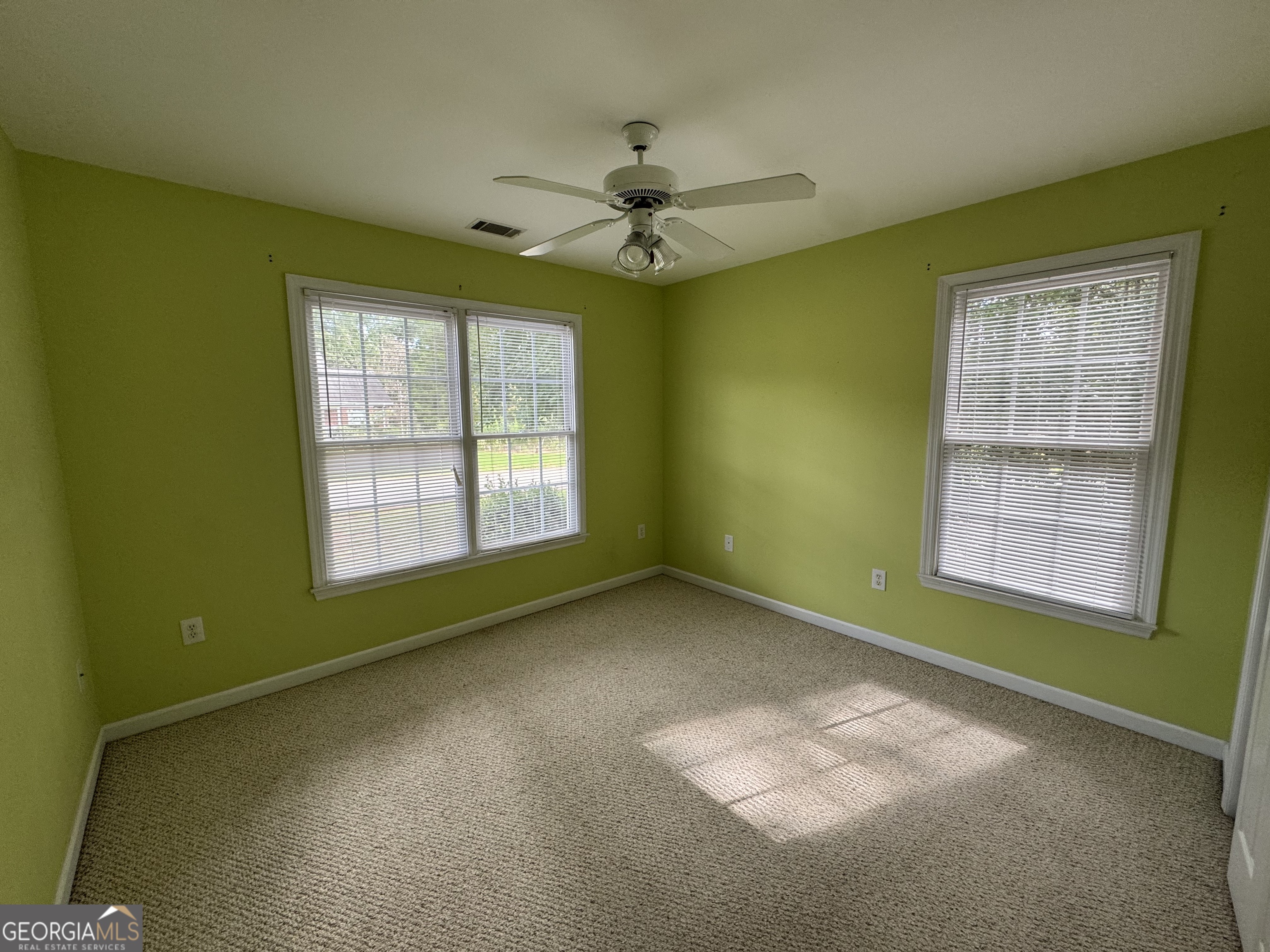 361 Brickleberry Ridge Athens, GA 30605 - Photo 13 of 23 en empty room with windows and ceiling fan