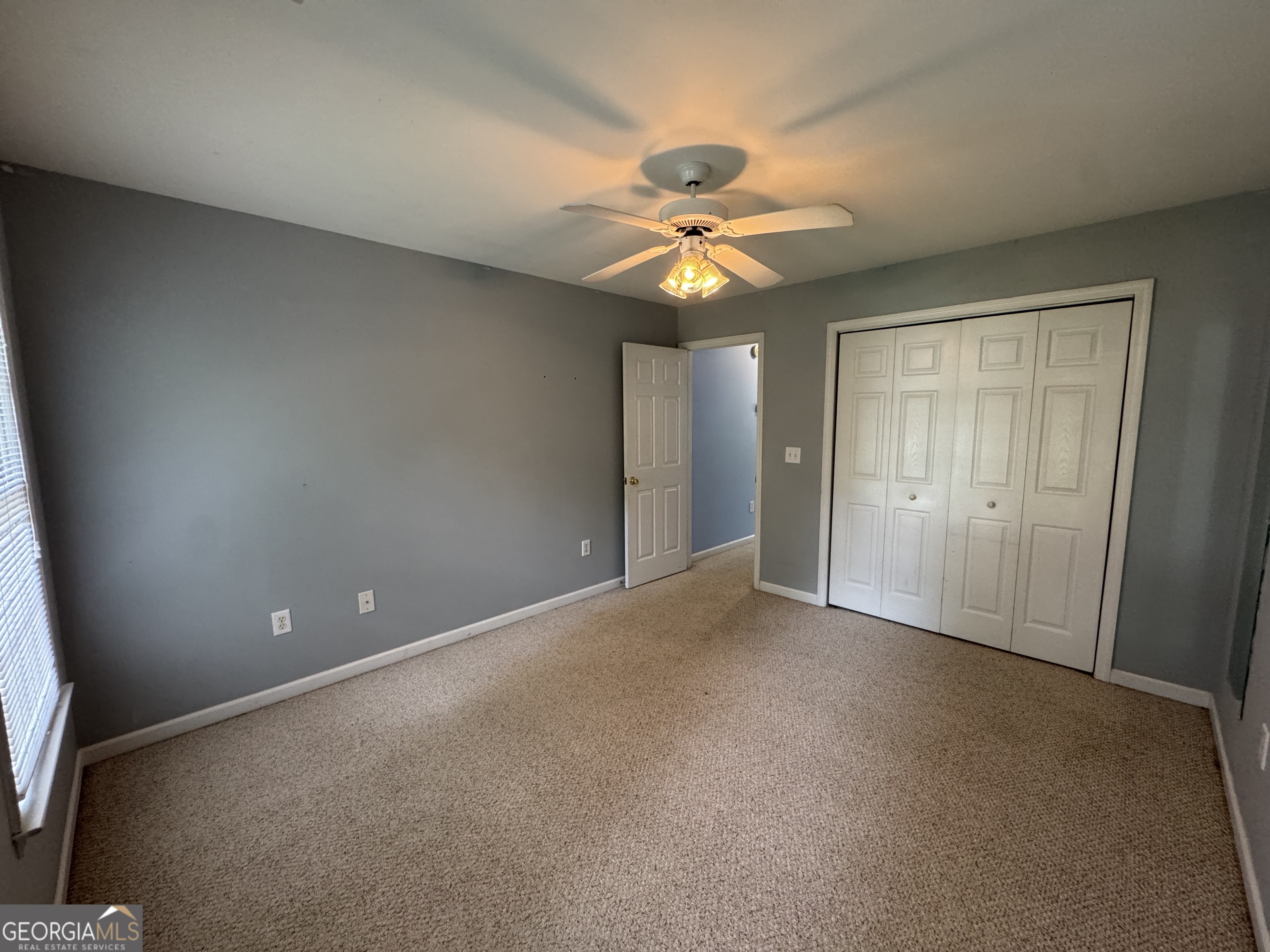 361 Brickleberry Ridge Athens, GA 30605 - Photo 16 of 23 a view of an empty room and a ceiling fan window