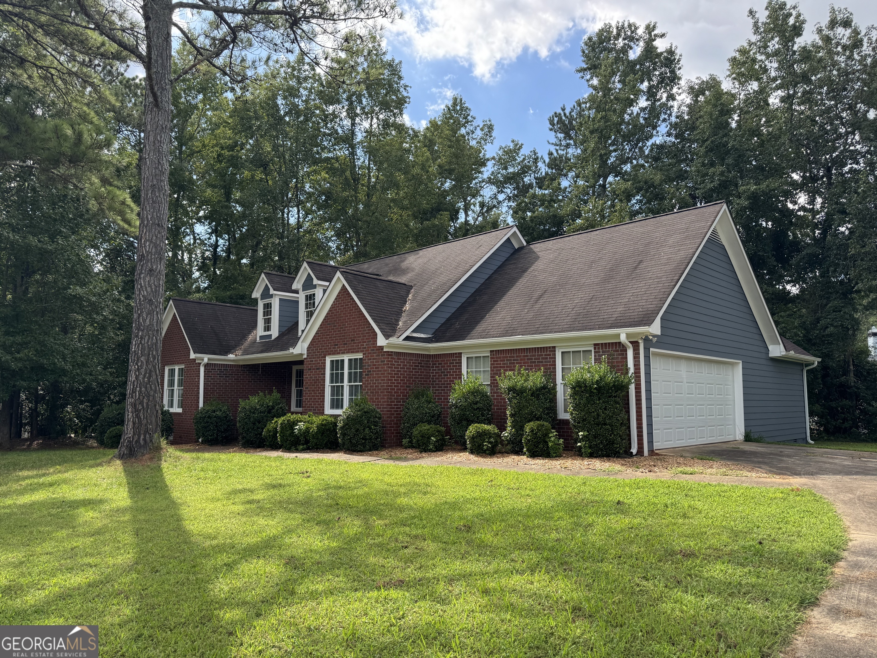 361 Brickleberry Ridge Athens, GA 30605 - Photo 2 of 23 a view of a house next to a big yard and large trees