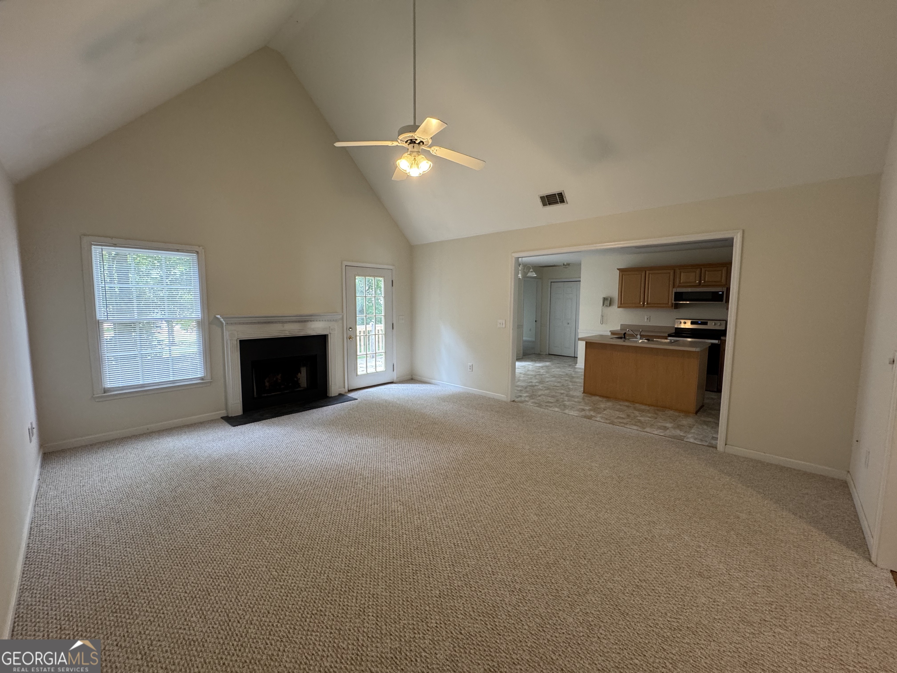 361 Brickleberry Ridge Athens, GA 30605 - Photo 7 of 23 an empty room with fireplace and a window