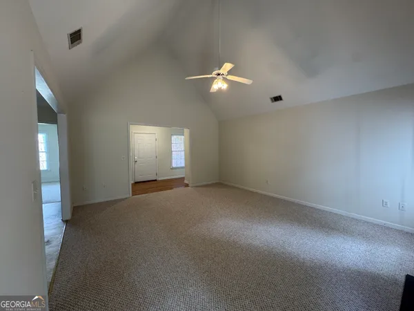 a view of empty room with windows