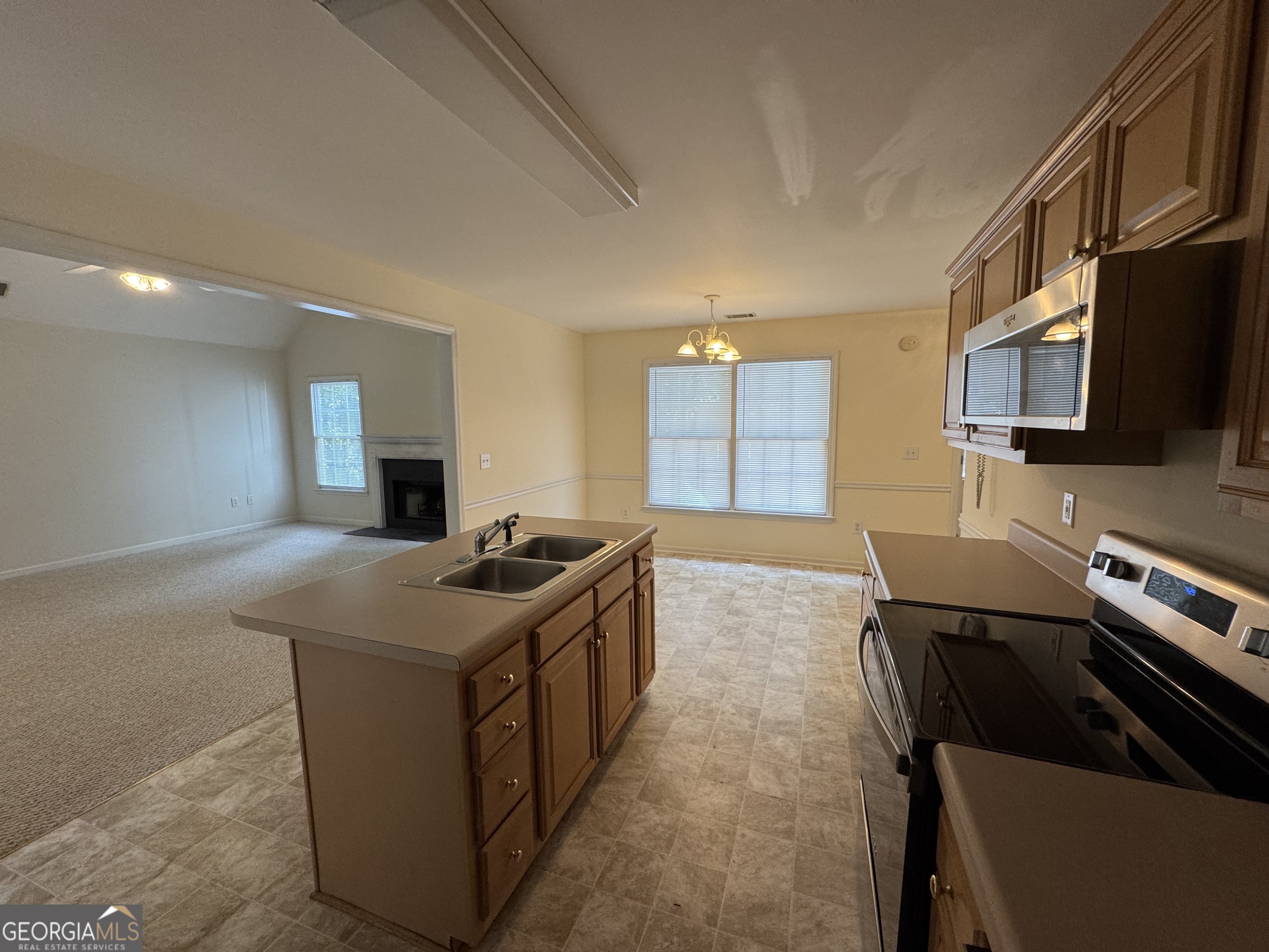 361 Brickleberry Ridge Athens, GA 30605 - Photo 10 of 23 a kitchen with stainless steel appliances granite countertop a stove and a sink