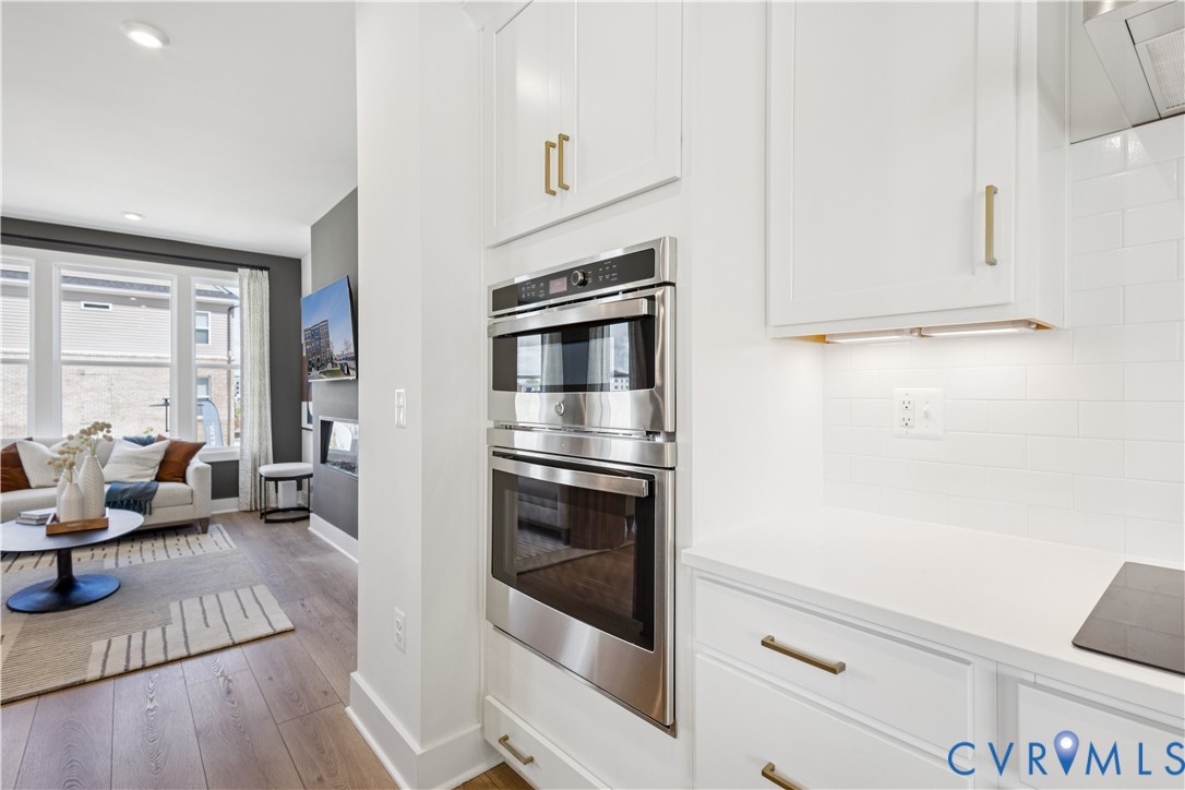 9434 Alquist Street Glen Allen, VA 23059 - Photo 11 of 45 a living room with furniture fireplace and wooden floor