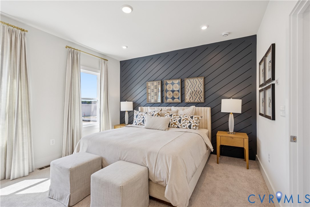 9434 Alquist Street Glen Allen, VA 23059 - Photo 21 of 45 a bedroom with a bed and a dresser