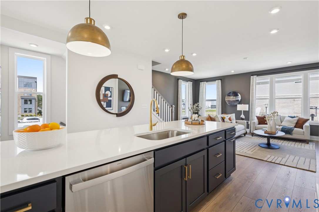 9434 Alquist Street Glen Allen, VA 23059 - Photo 9 of 45 a kitchen with a sink and a chandelier