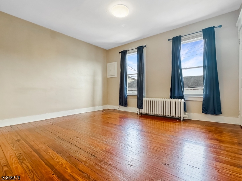 83 Jefferson Street, Unit B Phillipsburg, NJ 08865 - Photo 1 of 10 a view of a room with wooden floor and windows