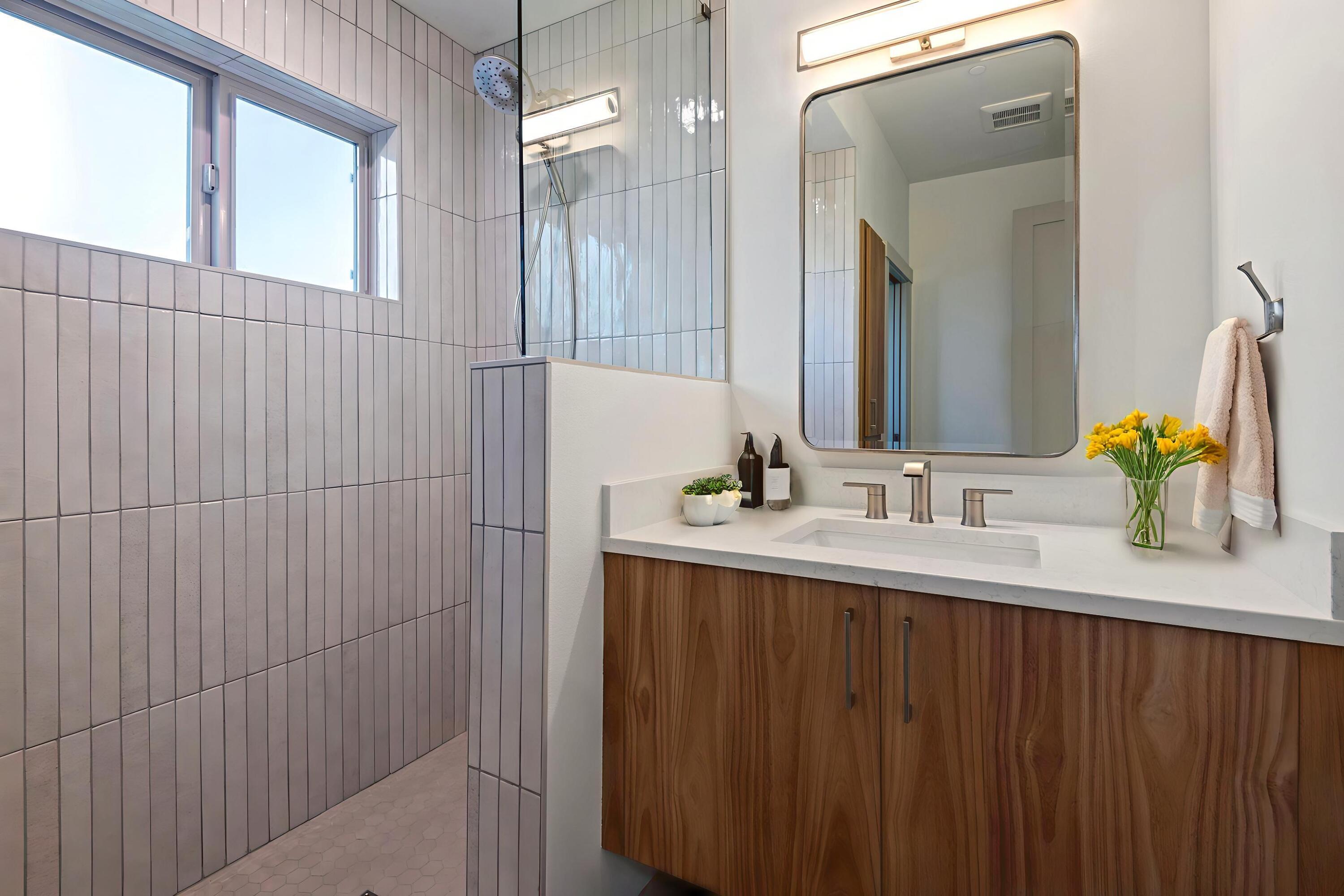 680 Southwest Otter Way Bend, OR 97702 - Photo 26 of 48 a bathroom with a sink vanity and a mirror