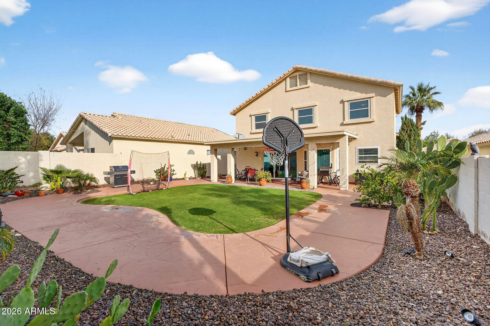 3615 East Desert Willow Road Phoenix, AZ 85044 - Photo 41 of 65 a front view of a house with a yard and garage