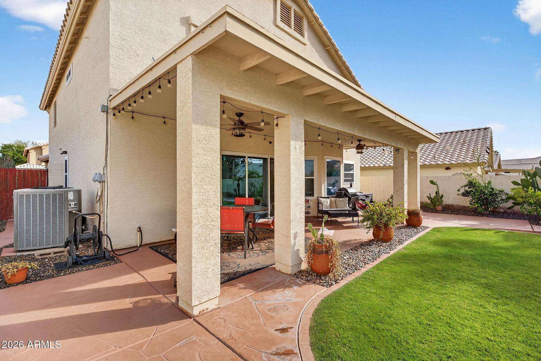 3615 East Desert Willow Road Phoenix, AZ 85044 - Photo 42 of 65 a view of a house with backyard and porch
