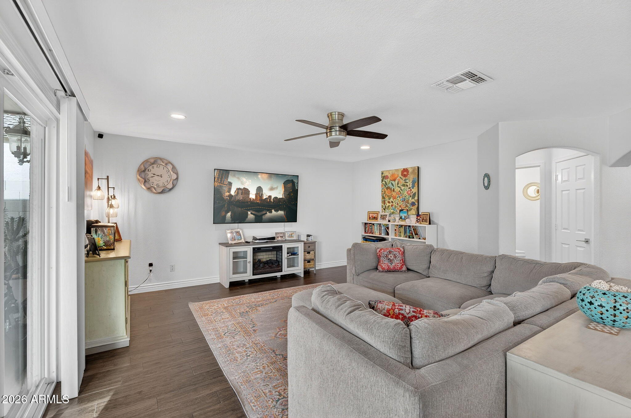 3615 East Desert Willow Road Phoenix, AZ 85044 - Photo 4 of 65 a living room with furniture and a flat screen tv